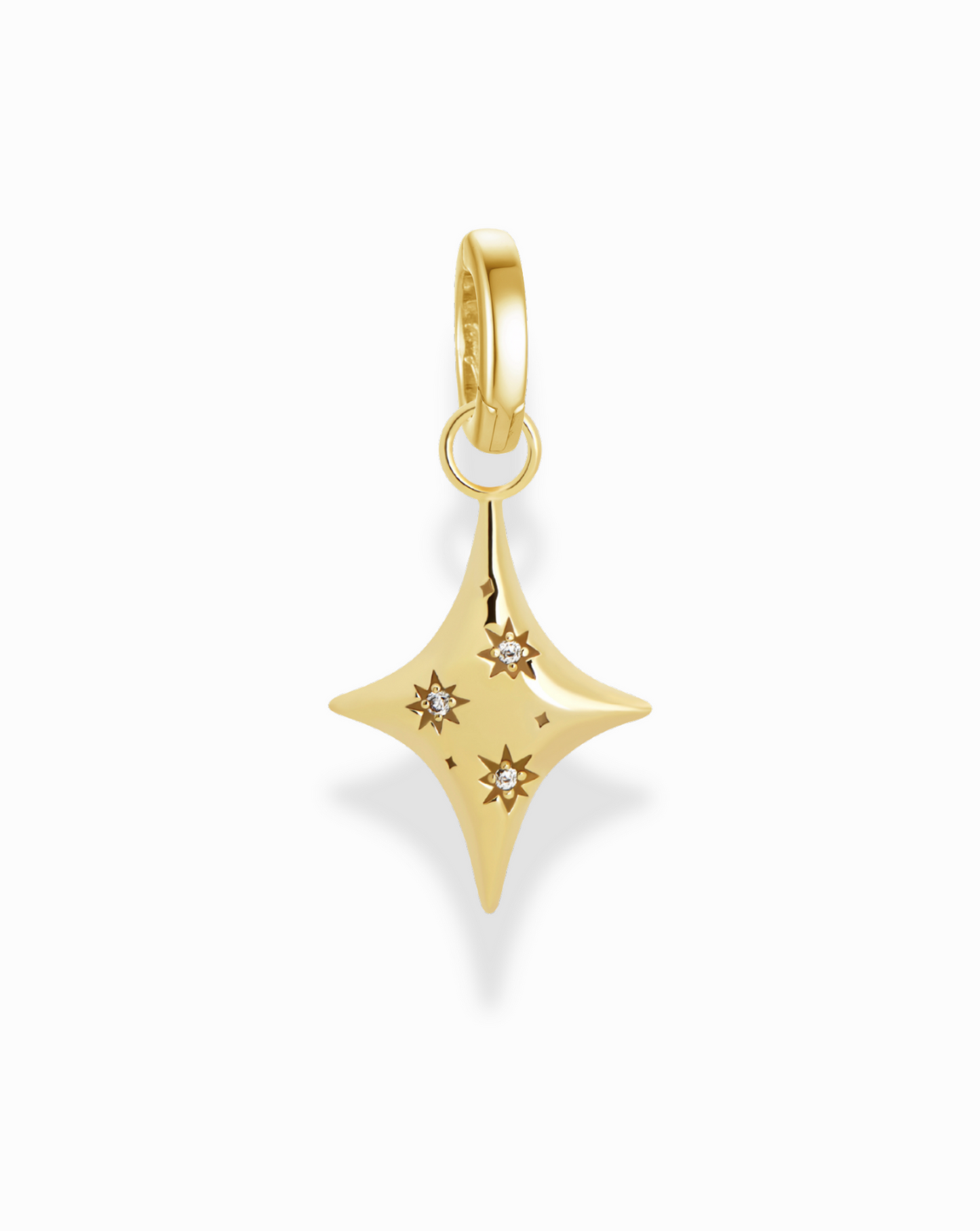 Close-up of the Celeste Puffy Star Charm. Shows the charm's gold tone and diamond accents.