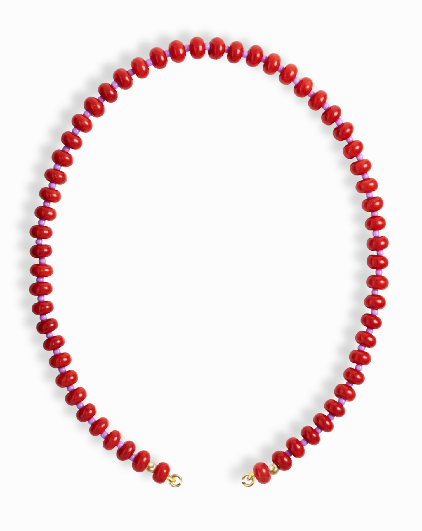 The Mod + Jo Macey Gemstone Necklace features evenly spaced round red natural semi-precious stones with small gold clasps at each end, arranged in an open circle on a white background.