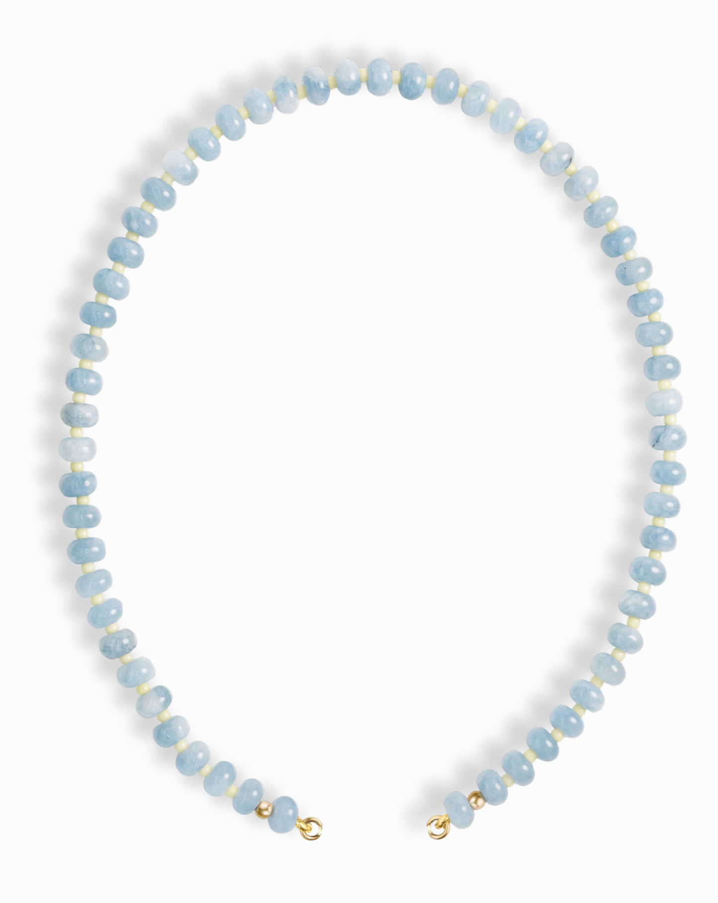 The Macey Gemstone Necklace by Mod + Jo features round, light blue beads with white marbling, strung in a single strand and finished with small gold clasps.