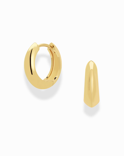 Corey Knife Edge Hoops jewelry. Elegant gold earrings on a white background, showcasing sleek, modern design and