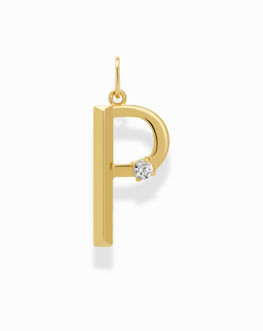 The Eloise Letter Charm by Mod + Jo features a gold pendant shaped like the letter “P” with a small round diamond accent on the curve, displayed against a white background.