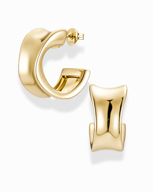 Gold, wide, and inverted curve earrings on a white background