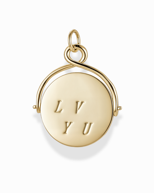 Gold pendant charm with 'LVYU' engraving on a white background