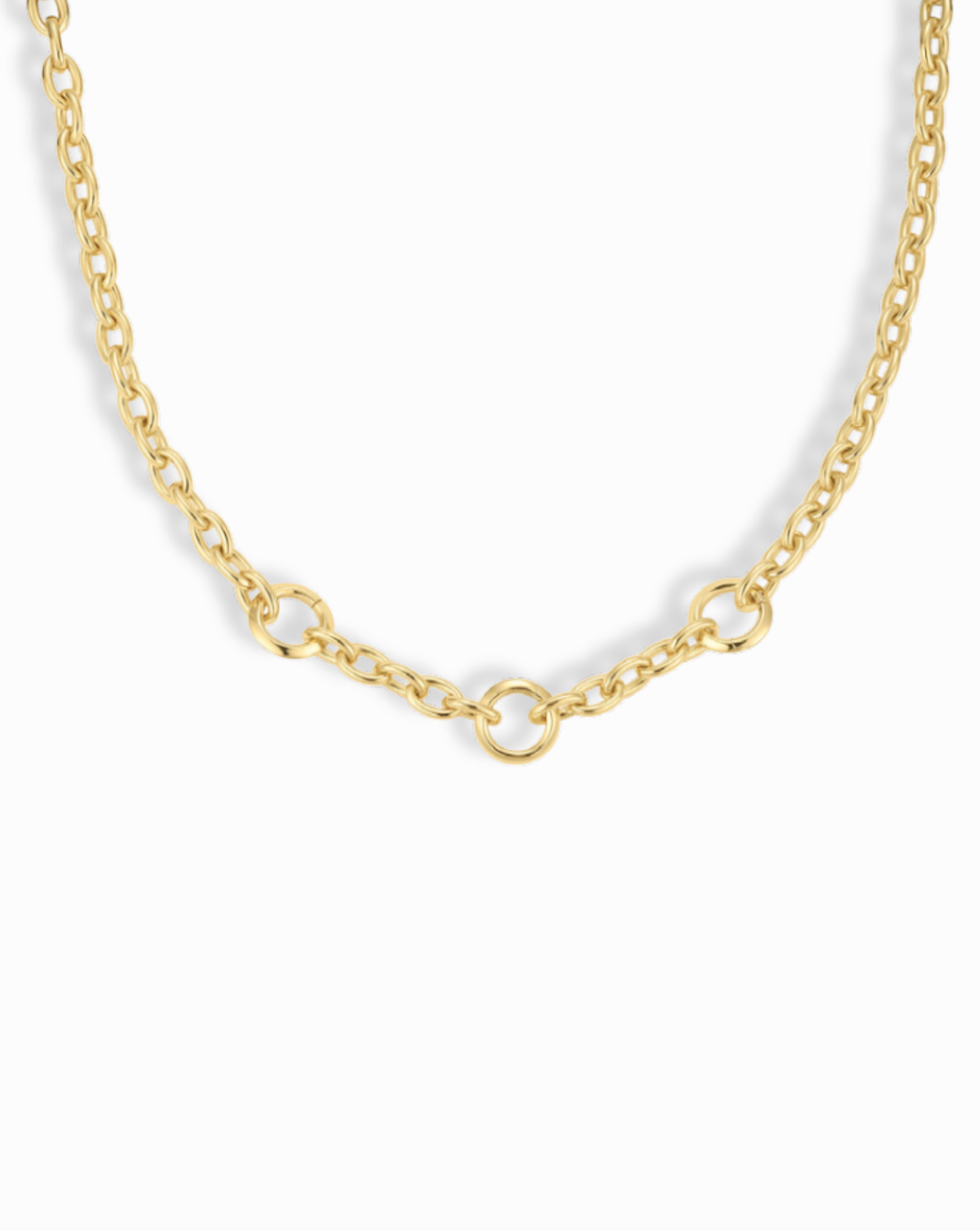 Close-up of the Camden Convertible Lariat Necklace, a gold chain necklace featuring circular link detailing at the front.
