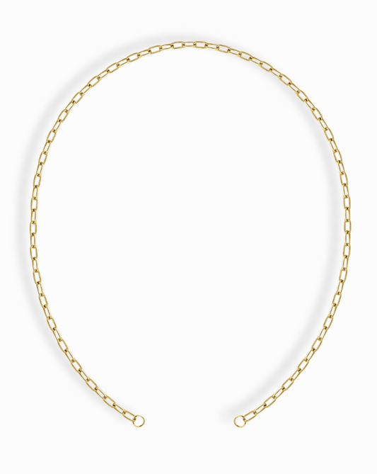 The Darcy Paperclip Enhancer Chain by Mod + Jo features elongated, rectangular links with 14k gold plating, finished with two small loops, and is styled in an open circle on a white background.