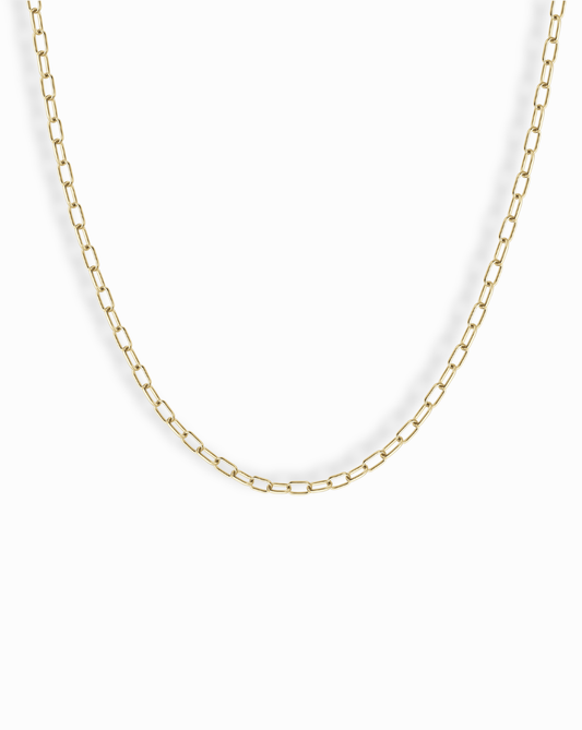 The Mod + Jo Darcy Mini Paperclip Chain Necklace features small, rectangular gold plated links and is displayed against a plain white background.