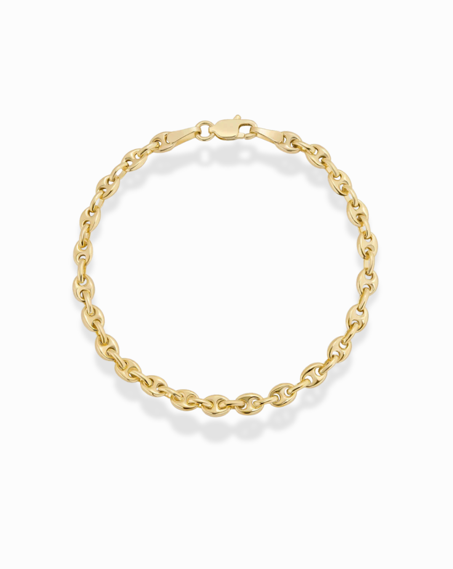 Gold puffy mariner chain bracelet on a white background