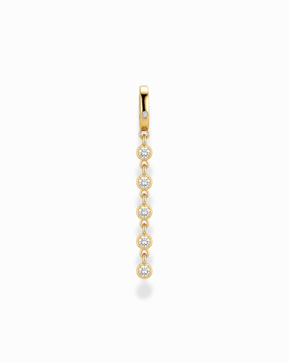 The Demi Tennis Charm by Mod + Jo features six round, vertically aligned cubic zirconia charms, each connected by delicate 14k gold-plated links, beautifully displayed on a white background.