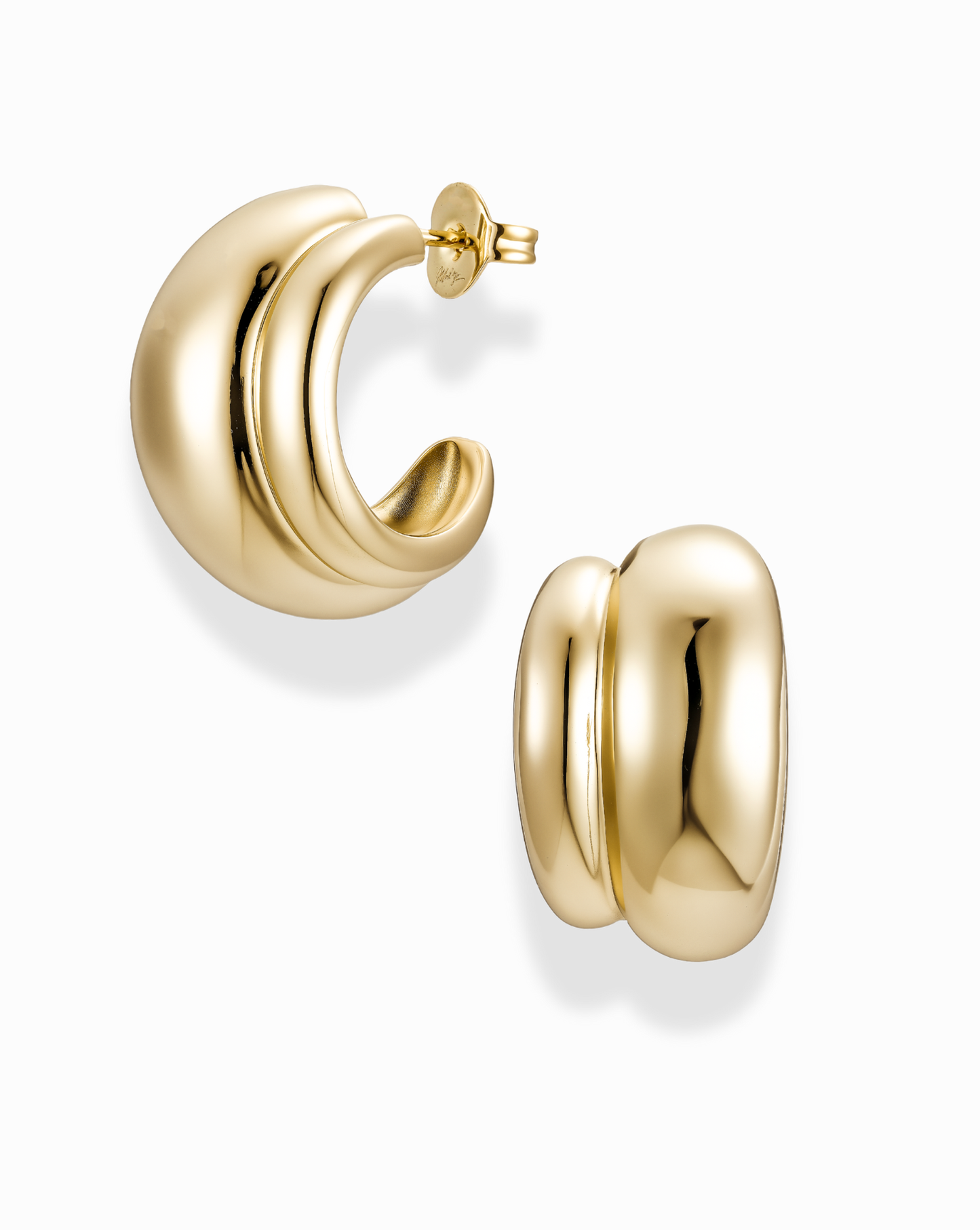 Gold double dome hoop earrings on a white background