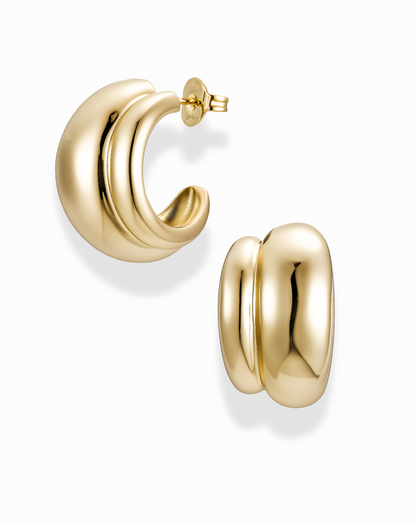 Gold double dome hoop earrings on a white background