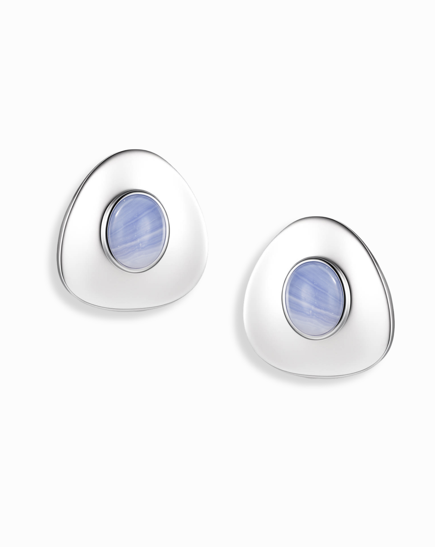 The Mod + Jo Hunter Statement Studs are silver triangular earrings with a central round blue chalcedony stone, shown on a white background.