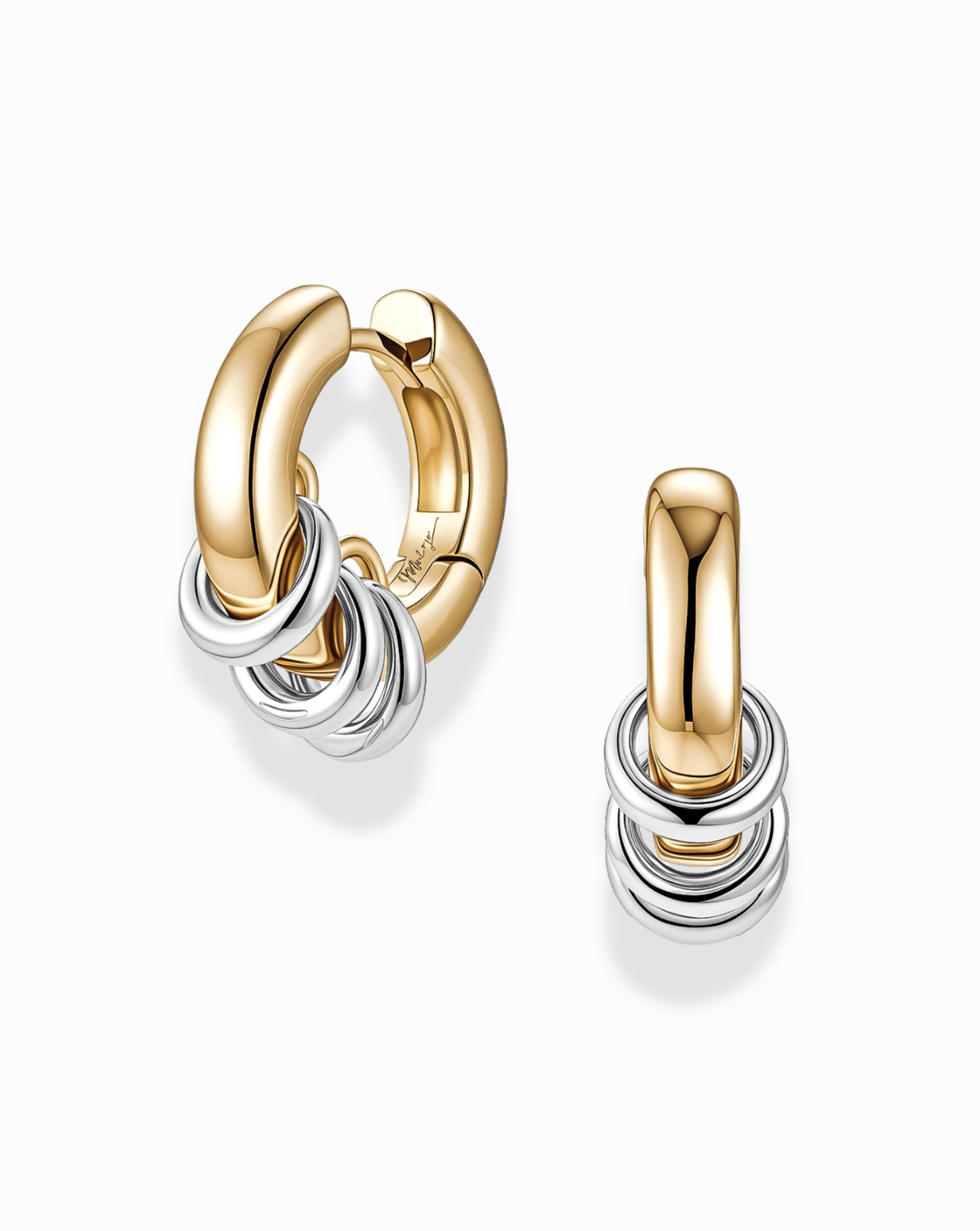 The Mod + Jo Grande Levi Huggies are gold plated earrings featuring three small silver rings on each huggie, elegantly displayed against a white background. Designed for comfortable everyday wear, these earrings are also nickel and lead free.