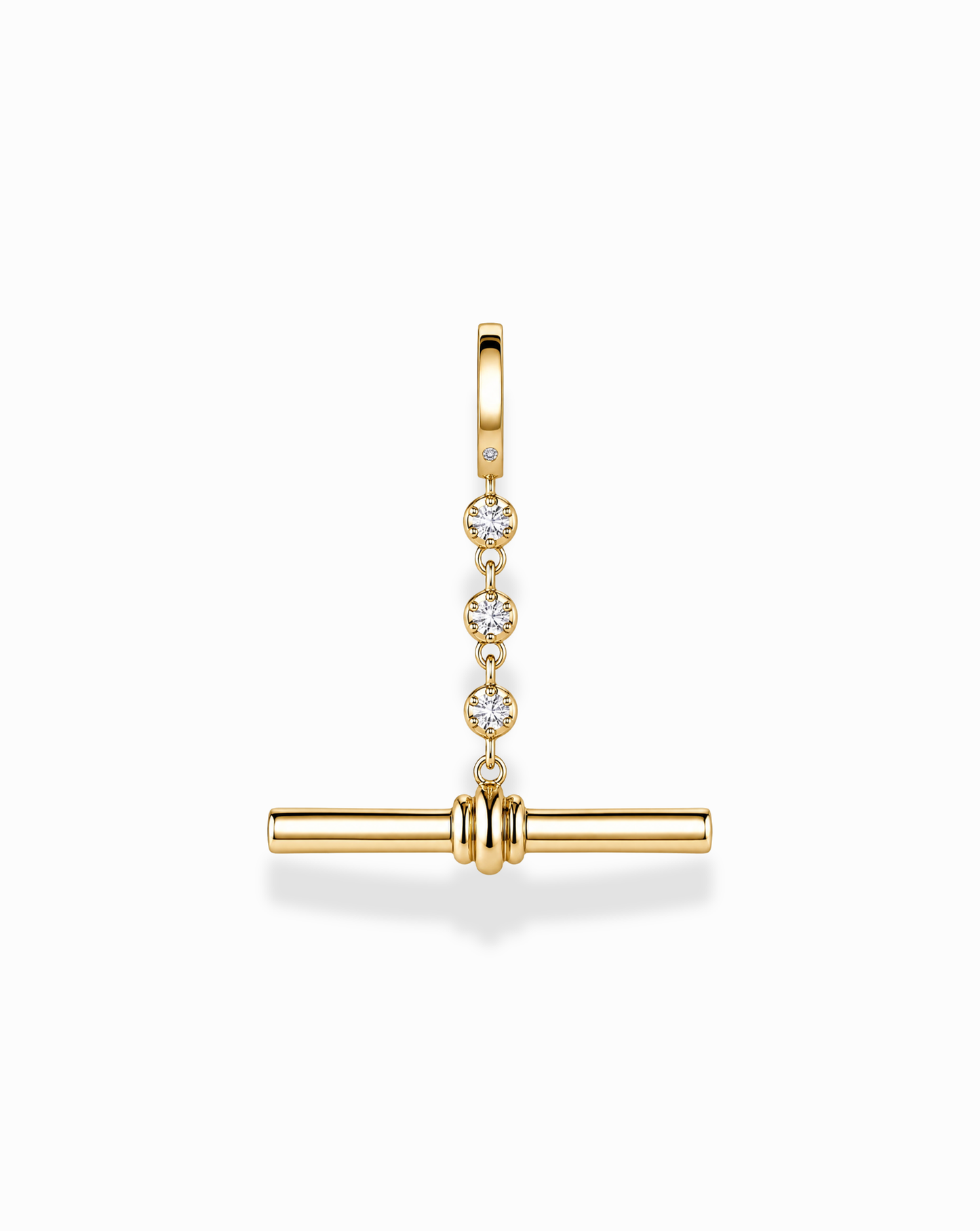 The Mod + Jo Livia Tennis Toggle Charm is a gold-plated jewelry pendant featuring three small diamonds set vertically, with a horizontal gold bar suspended below, shown against a white background.