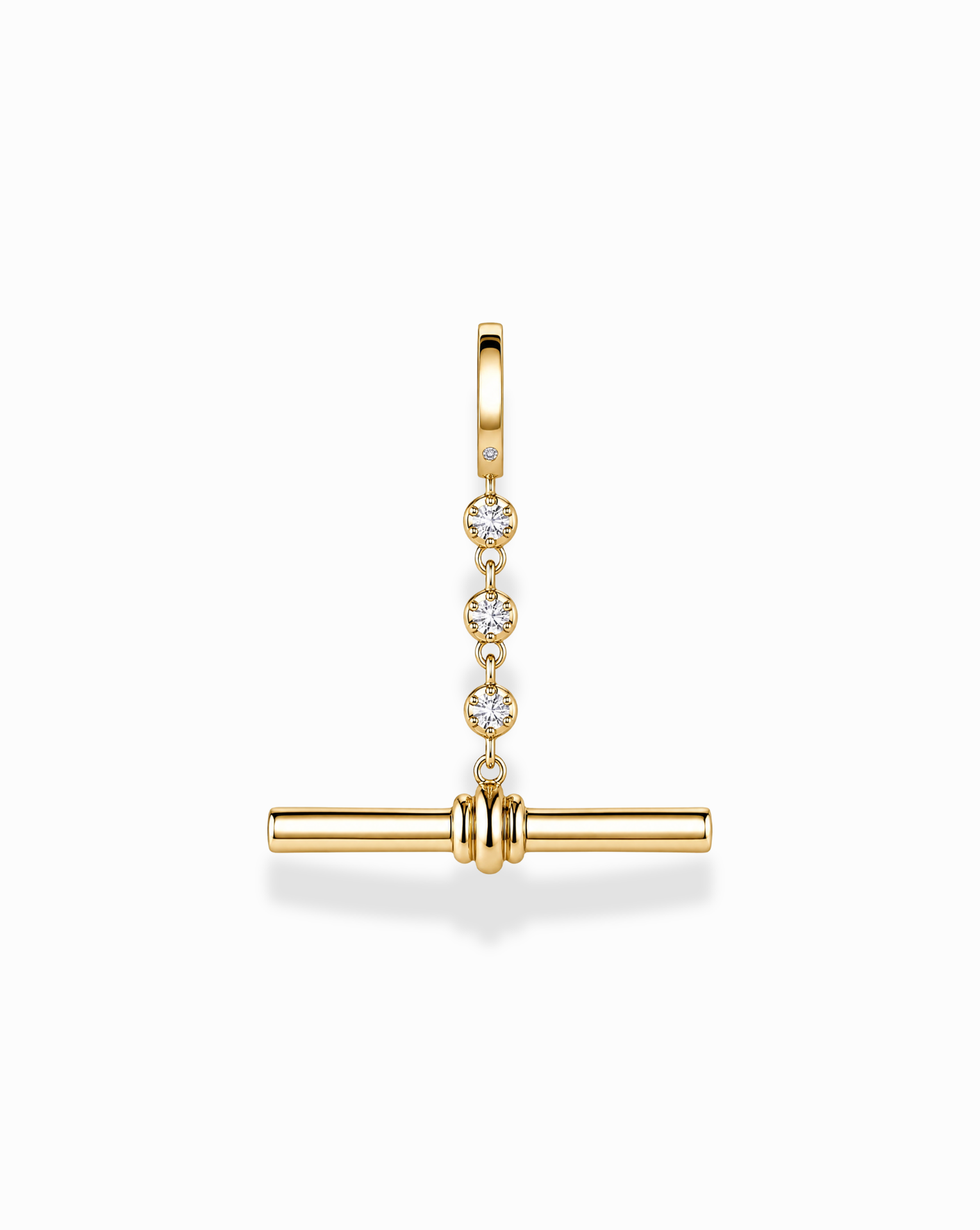The Mod + Jo Livia Tennis Toggle Charm is a gold-plated jewelry pendant featuring three small diamonds set vertically, with a horizontal gold bar suspended below, shown against a white background.