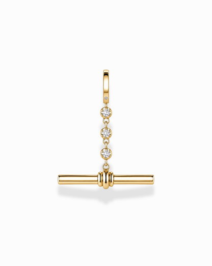 The Mod + Jo Livia Tennis Toggle Charm is a gold-plated jewelry pendant featuring three small diamonds set vertically, with a horizontal gold bar suspended below, shown against a white background.