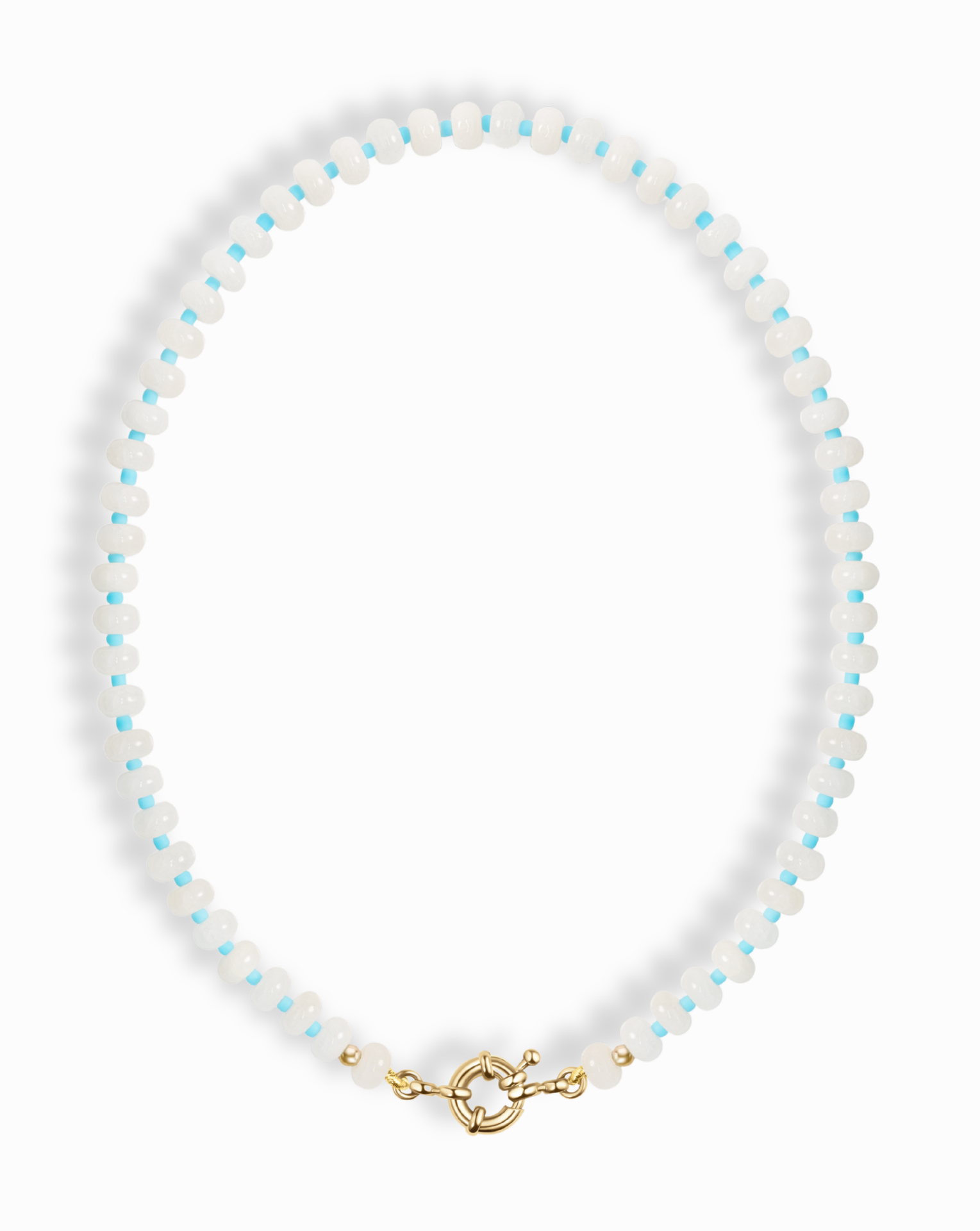 The Mod + Jo Macey Gemstone Necklace features alternating small white jade and light blue beads, accented with gold beads near the gold clasp, shown on a white background.
