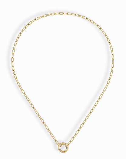 The Mod + Jo Darcy Charm Clip Necklace features elongated oval links and a central circular ring pendant, all in 14k gold plating, shown on a white background.