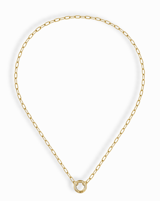 The Mod + Jo Darcy Charm Clip Necklace features elongated oval links and a central circular ring pendant, all in 14k gold plating, shown on a white background.