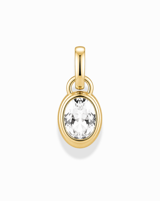 The Olly Sapphire Bezel Charm by Mod + Jo features a round, clear lab-grown white sapphire bezel-set in 14k gold, shining against a white background.