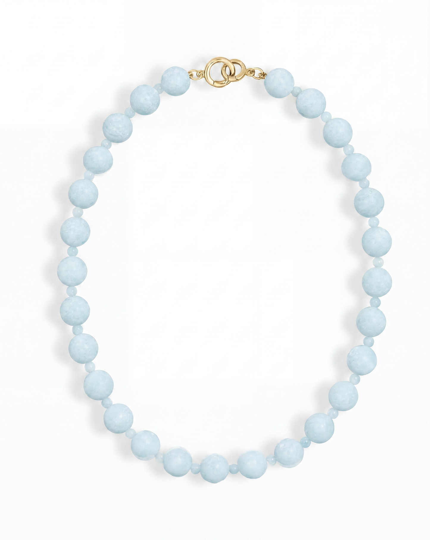 The Portia Gemstone Necklace by Mod + Jo features a single strand of round, light blue natural aquamarine beads with a gold clasp, displayed on a white background.