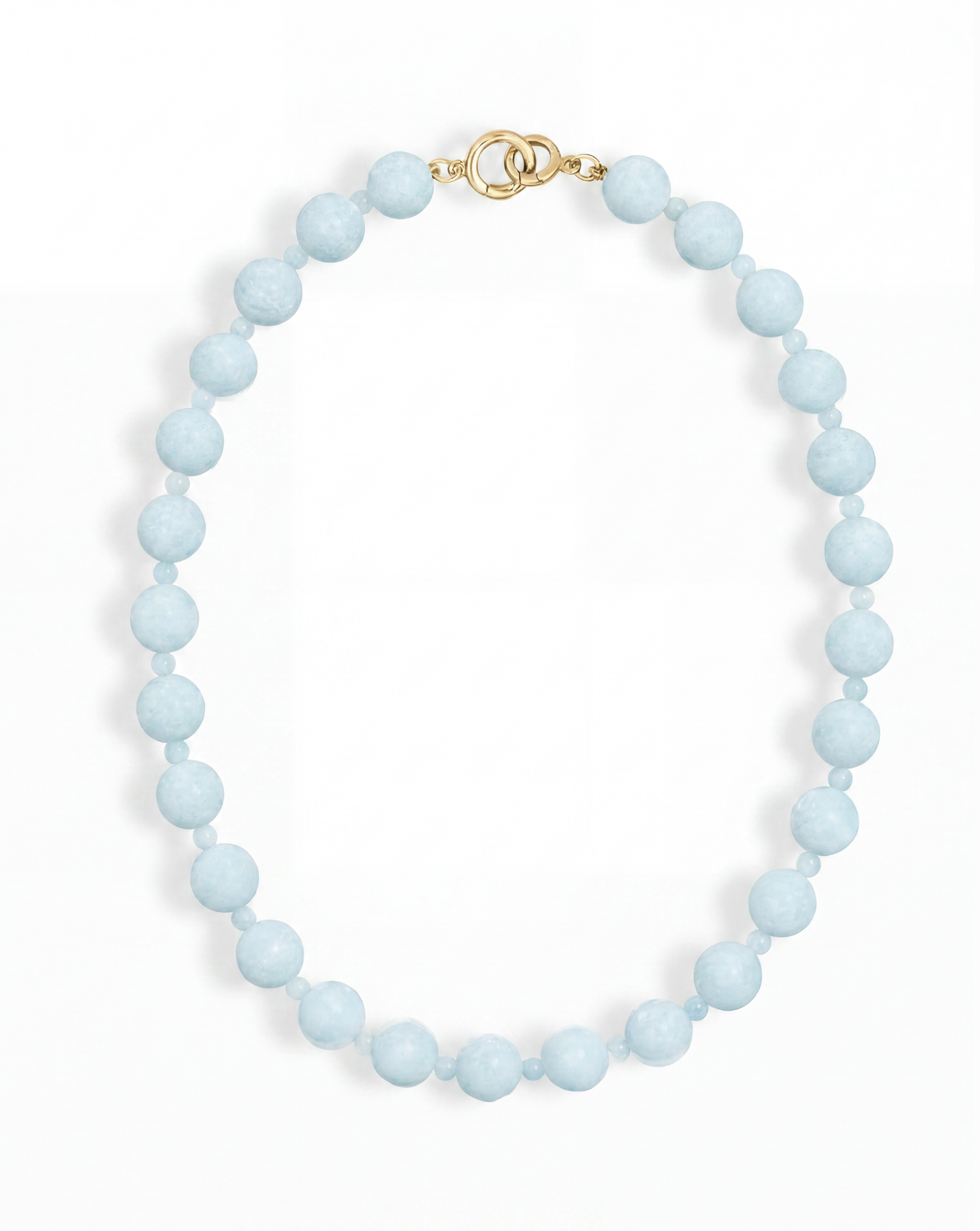 The Portia Gemstone Necklace by Mod + Jo features a single strand of round, light blue natural aquamarine beads with a gold clasp, displayed on a white background.