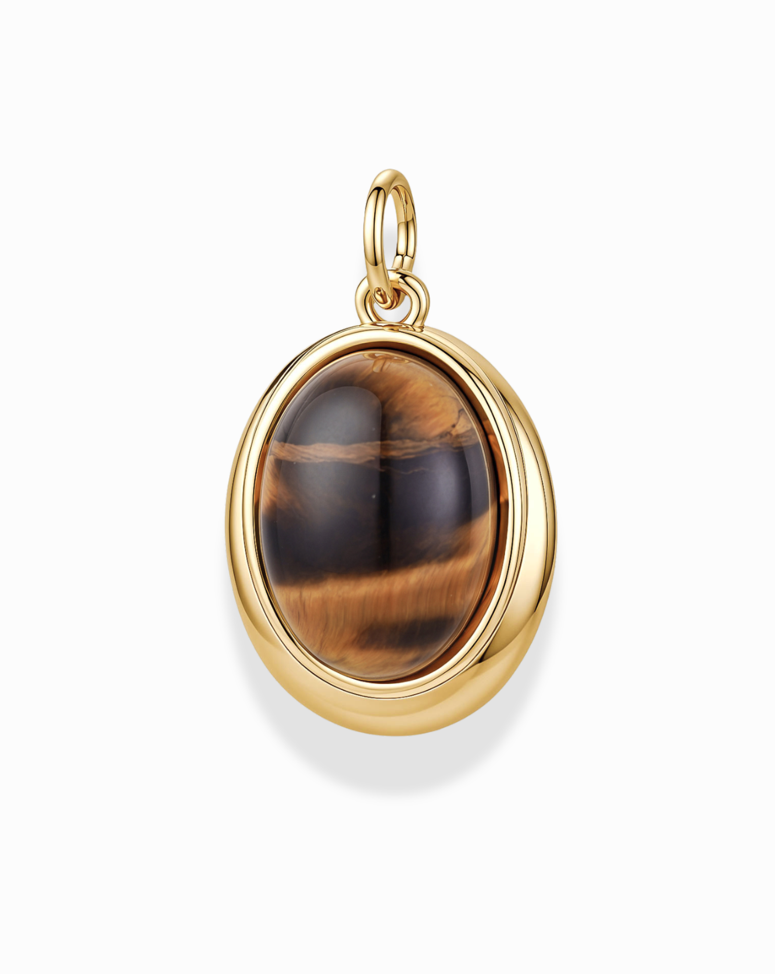 Introducing the Rory Gemstone Charm by Mod + Jo—a stunning gold-plated pendant showcasing an oval Tiger’s Eye gemstone with mesmerizing brown and golden bands. This exquisite piece is set in a polished 14k gold bezel with a convenient loop for your favorite chain, elegantly displayed against a white background. The Rory Gemstone Charm beautifully captures the natural allure of Tiger’s Eye, making it a standout addition to any jewelry collection.