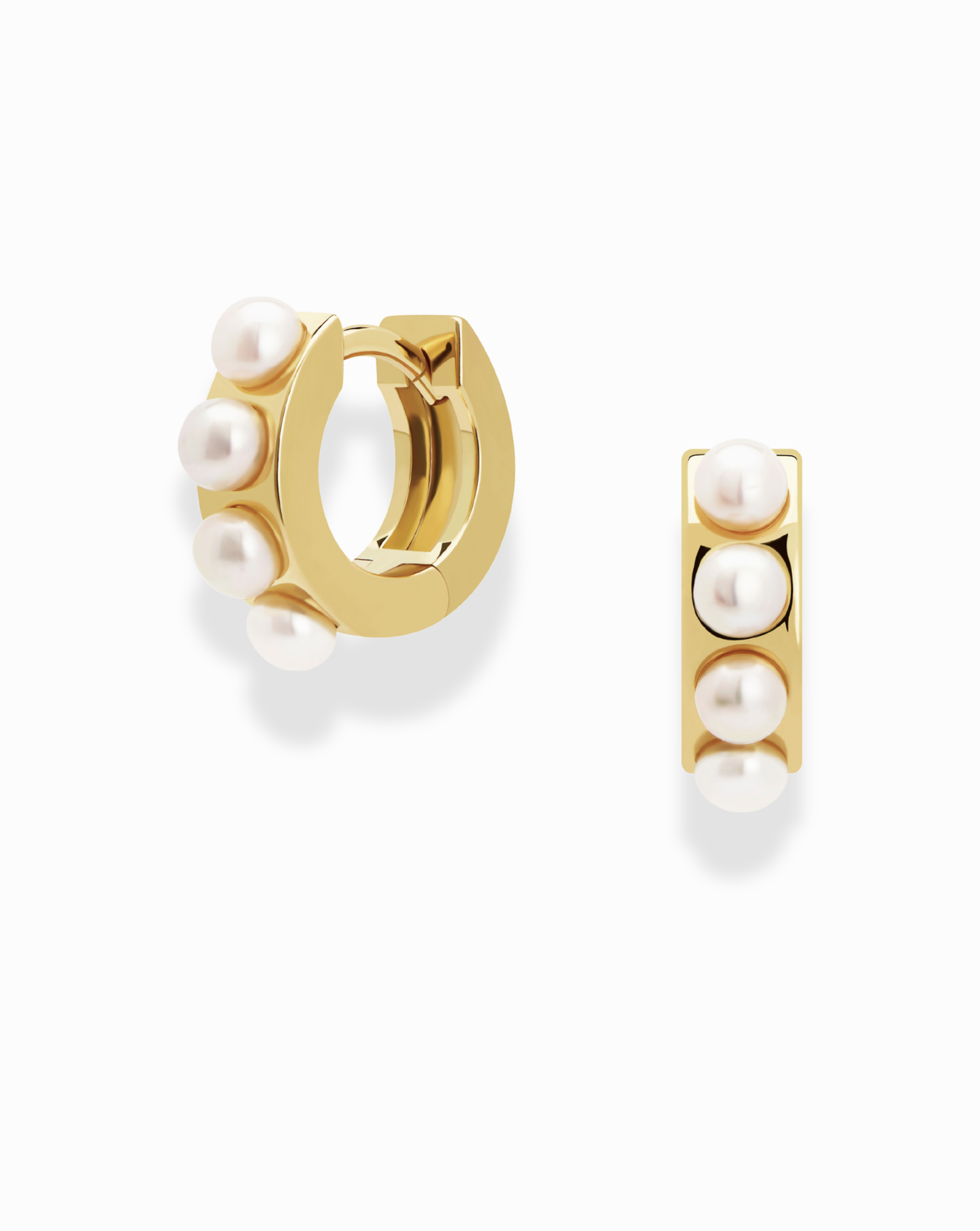 The Mod + Jo Rosie Pearl Huggies are small gold hoops, each featuring three vertically-set white pearls on the front, displayed against a plain white background.