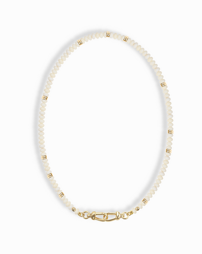 Close-up of the Sonia Gemstone Necklace, featuring delicate white beads and gold accents, highlighting its elegant design.
