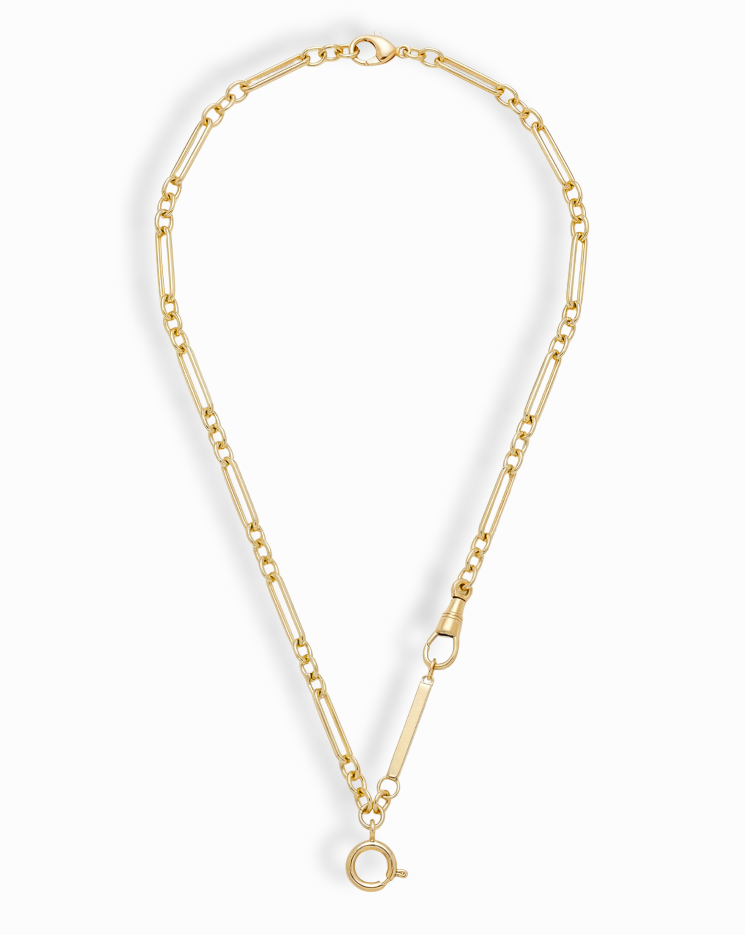 The Liam Space Bar Chain Necklace by Mod + Jo features a 14k gold-plated elongated oval link design with a large round clasp at the bottom and a smaller side clasp, arranged in an open circle on a white background.