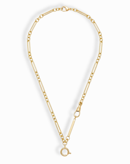 The Liam Space Bar Chain Necklace by Mod + Jo features a 14k gold-plated elongated oval link design with a large round clasp at the bottom and a smaller side clasp, arranged in an open circle on a white background.