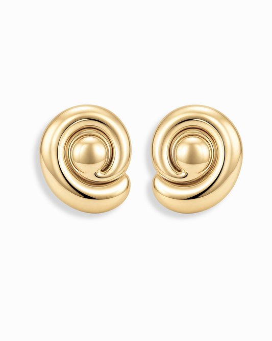 The Milley Spiral Statement Studs by Mod + Jo are 14k gold spiral stud earrings with a smooth, swirling design—perfect for everyday wear and featured against a white background.