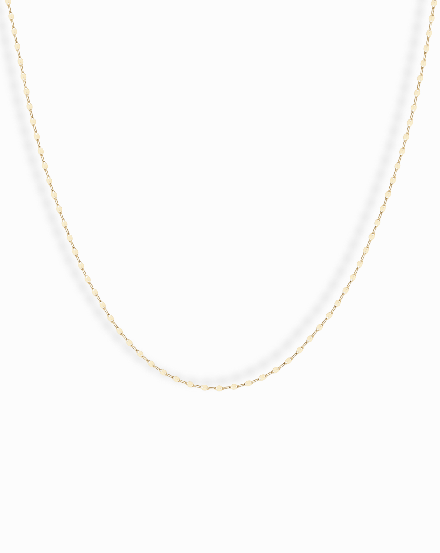 The Winnie Sparkle Chain Necklace features a delicate gold-filled chain with small, evenly spaced oval links for a subtle, elegant look—ideal for layering and displayed beautifully against a white background.