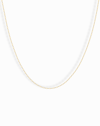 The Winnie Sparkle Chain Necklace features a delicate gold-filled chain with small, evenly spaced oval links for a subtle, elegant look—ideal for layering and displayed beautifully against a white background.